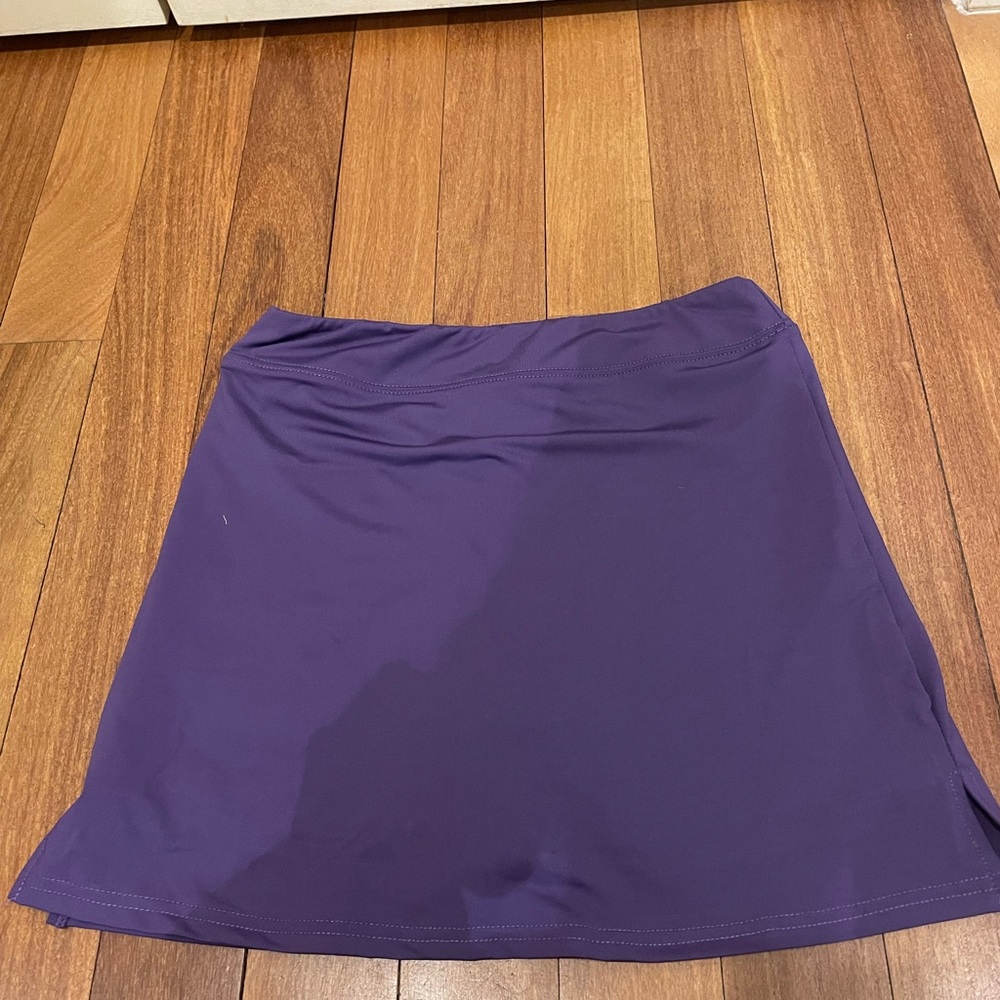 Purple athletic skirt.